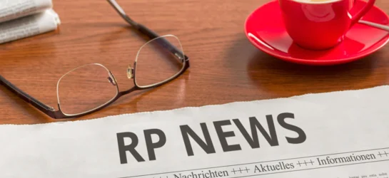 newspaper of RP News with a cup of coffee